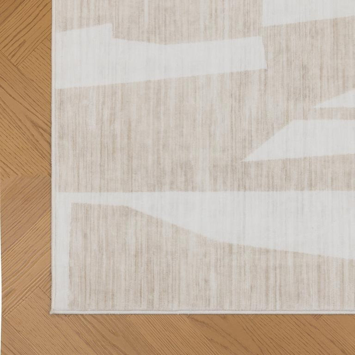 Tapis Millau, coloris ivoire et beige, le bord de près