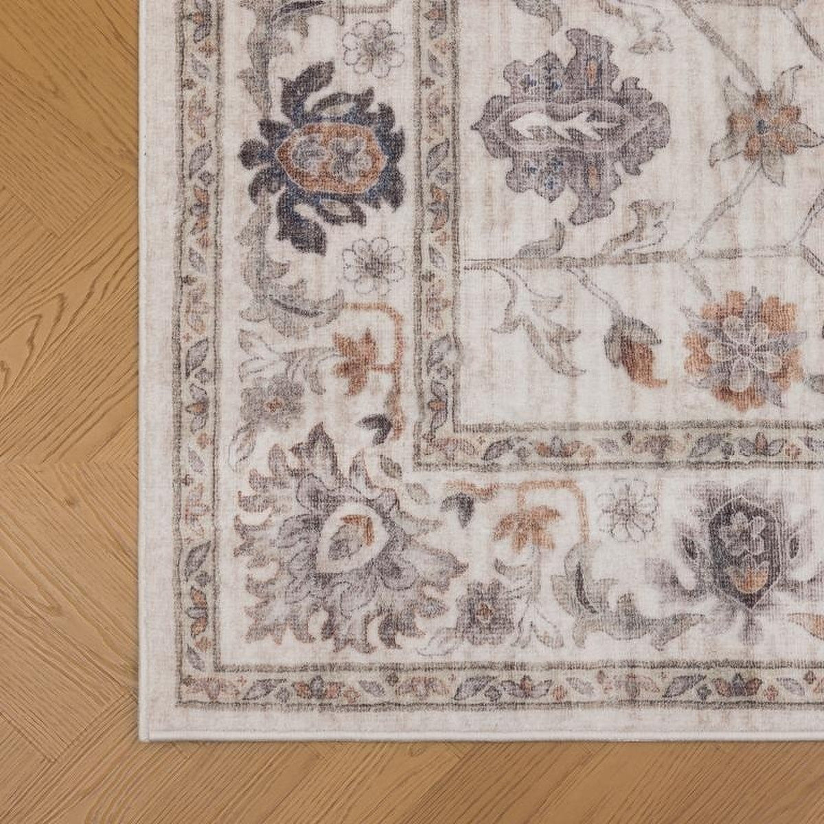 Tapis Albi, coloris beige et terracotta, le bord de près